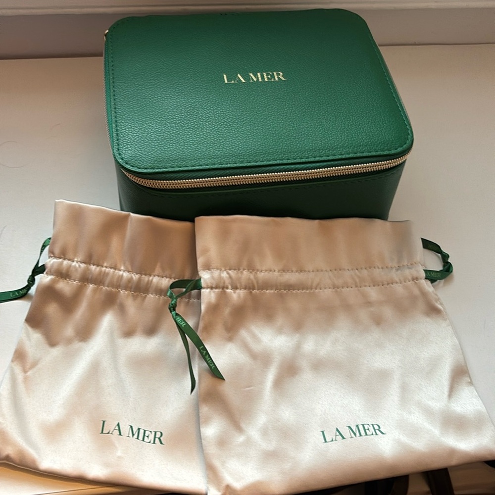 La Mer zip travel case and 2 drawstring pouches